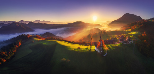 Wall Mural - aerial sunrise view of saint tomas church, slovenia. autumn landscape.