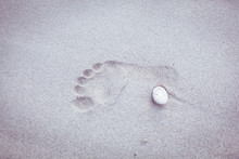 Foot Print On The Beach Sand