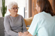© goodluz - Nurse talking to old woman, assistance and support