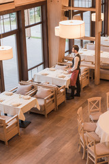 Wall Mural - Waiter serving plates on table