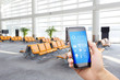 © zhu difeng - smart phone with smart home with modern airport hall