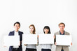 © metamorworks - Group of people showing white boards.