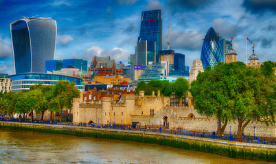 Wall Mural - LONDON - SEPTEMBER 25, 2016: City skyline along river Thames. London attracts 30 million people annually