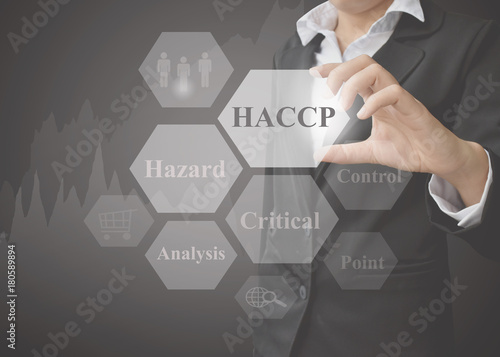 Fotografía Business woman showing presentation of meaning of HACCP concept (Hazard Analysis of Critical Control Points) a principle on black background for use in business, company system and training
