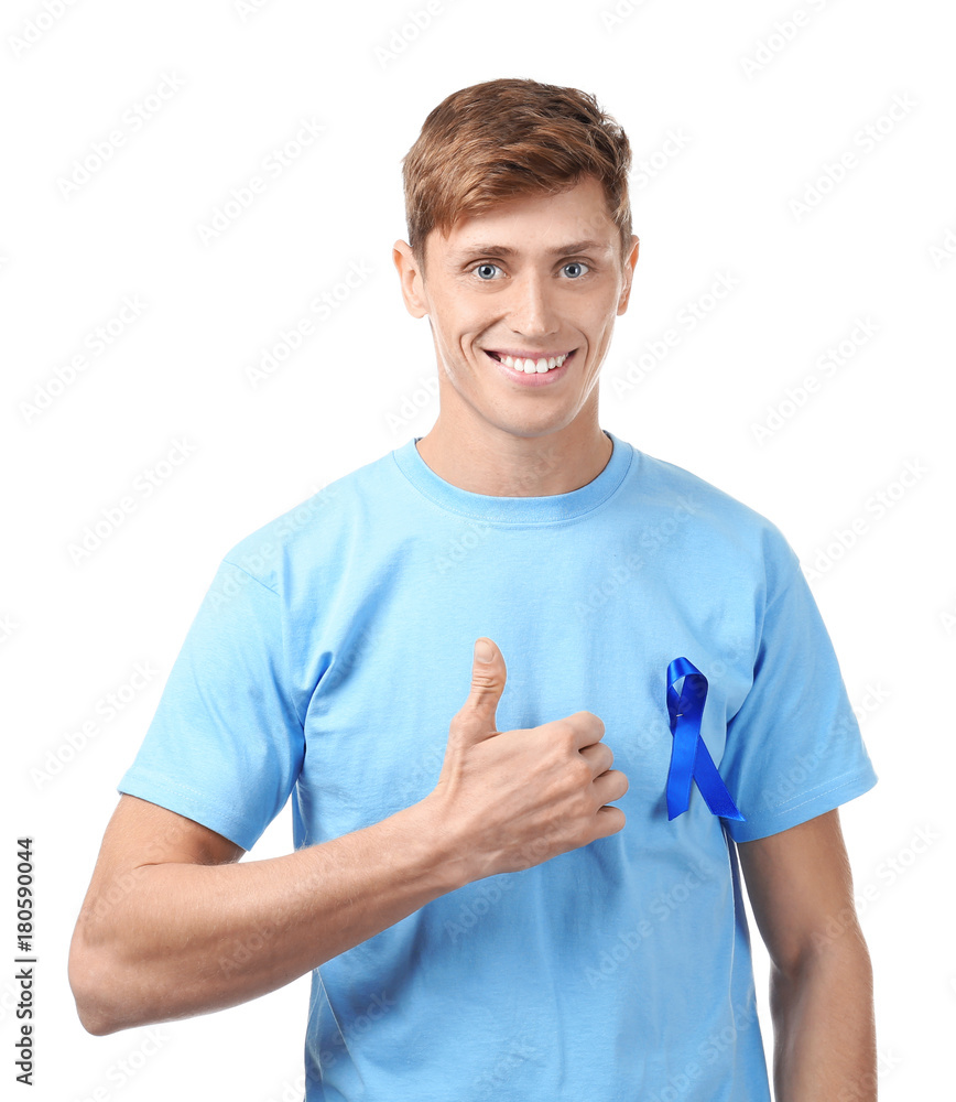 Young man wearing t-shirt with blue ribbon on white background. Prostate cancer awareness concept