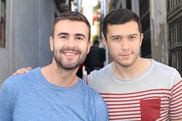 Wall Mural - Two handsome young men dating outdoors  