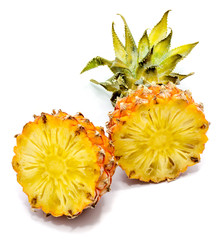 Two pineapple halves isolated on white background.