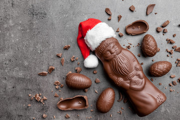 Delicious Christmas chocolate and sweets on rustic background