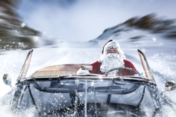 Poster - The people in the black cabriolet are hurrying for Christmas. Winter road through the mountains of the Alps.