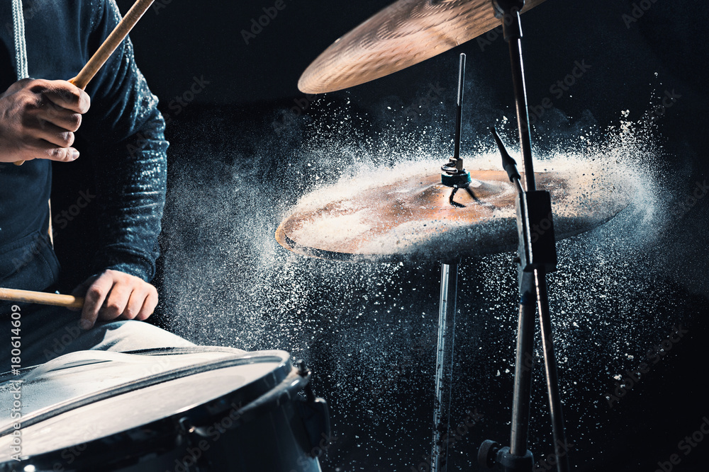 Drummer rehearsing on drums before rock concert. Man recording music on drum set in studio - obrazy, fototapety, plakaty 