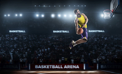 Wall Mural - one basketball player jump in stadium panorama view