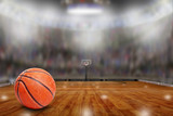 Fototapeta Sport - Basketball Arena With Ball on Court and Copy Space