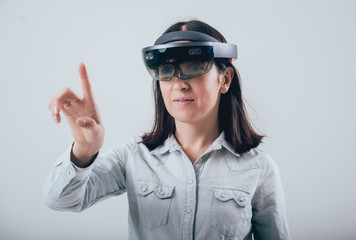 Woman wearing augmented reality goggles.