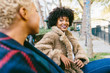 © Christin Nzobadila-Bela/PICHA - Friends sitting in a bench