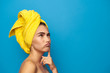 woman with a towel on her head lost in thought