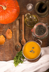 Poster - pumpkin soup on rustic wooden background