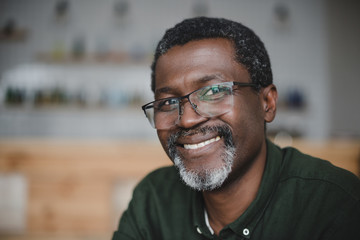 Wall Mural - mature african american man in bar