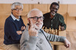 © LIGHTFIELD STUDIOS - senior friends playing chess