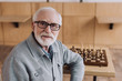 © LIGHTFIELD STUDIOS - senior man with chess board