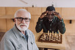 © LIGHTFIELD STUDIOS - senior man playing chess