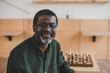 © LIGHTFIELD STUDIOS - smiling mature man with chess