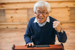 © LIGHTFIELD STUDIOS - asian man celebrating victory