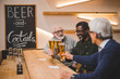 © LIGHTFIELD STUDIOS - senior friends drinking beer together