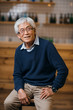 © LIGHTFIELD STUDIOS - senior asian man in bar