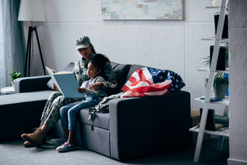 daughter and soldier reading book