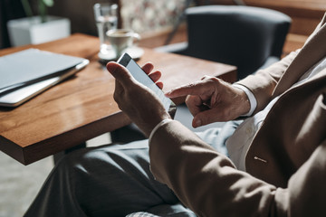 Wall Mural - Businessman Using Smartphone