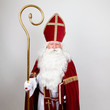 Saint Nicholas standing with his big book and staff
