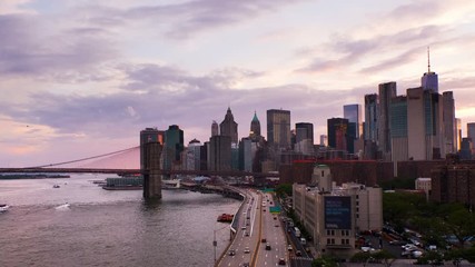 Sticker - New York, USA. Aerial view on the city skyline in New York City, USA during the sunset. Famous skyscrapers of the concrete jungle and car traffic. Brooklyn bridgeю Zoom in