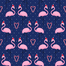 Flamingo In Xmas Hat With Candy Cane Heart Seamless Pattern On Blue Polka Dots Background. Exotic New Year Background. Christmas Design For Fabric, Wallpaper, Textile And Decor.