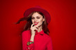 © SHOTPRIME STUDIO - woman in hat with brown hair on red background