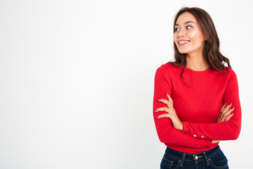 Poster - Pretty young happy woman standing with arms crossed