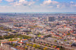 Aerial wide-angle cityscape of The Hague (Den Haag) with the North Sea and cloudy blue sky, Netherlands