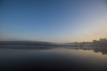 morning fog on a quiet lake