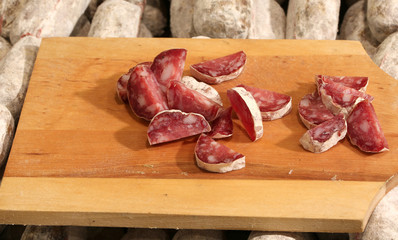 cutting board with salami for sale in the street stall