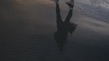 Barefoot Person Walks Along Wharariki Beach, Tracking Shot