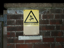 Outside Yellow Danger Of Death Warning Sign Wall