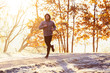 © baranq - Man jogging outdoors on cold autumn morning