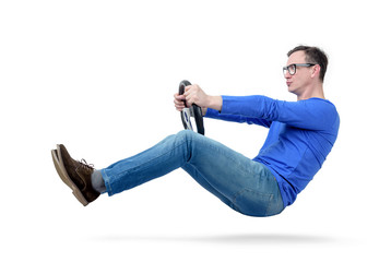 Wall Mural - Man in glasses drives a car with a steering wheel, isolated on white background