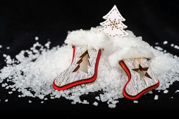 Christmas decoration with two shoe , snow pile and tree.