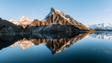 Sunset At A Calm Mountain Lake In Austria With Mirror-like Reflection