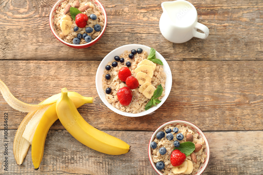 Composition with tasty oatmeal on table