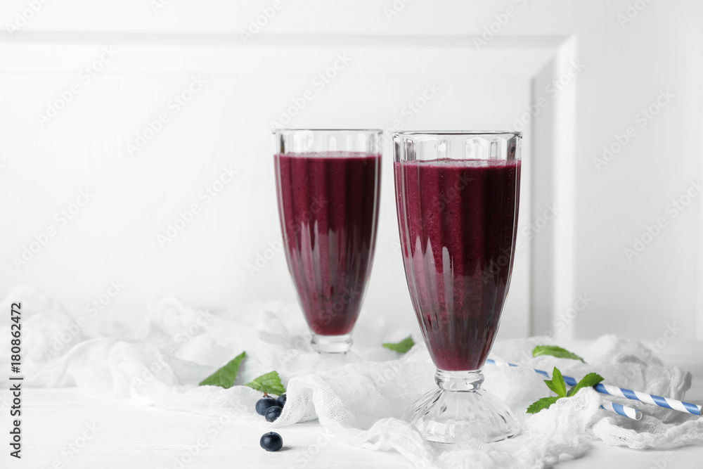 Glasses with acai juice on table