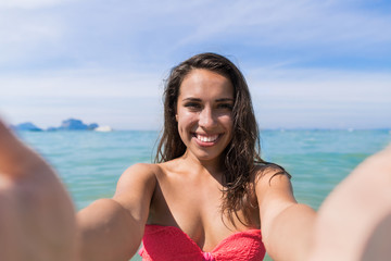 Wall Mural - Attractive Young Caucasian Woman In Swimsuit On Beach Taking Selfie Photo, Girl Blue Sea Water Holiday Summer Vacation