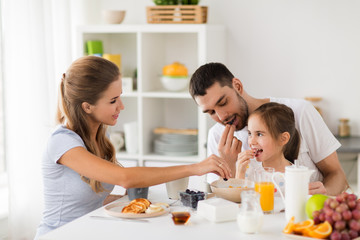 Poster - happy family having breakfast at home