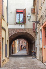 Wall Mural - Old narrow medieval street of the center of Ferrara