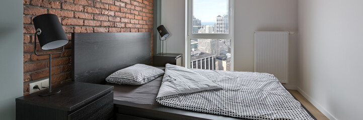 Industrial style bedroom with bed